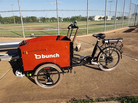 Bunch bikes - A three-wheeled cargo bike with a large front box that can carry pets, boxes, or kids. Read the pros and cons, specs, and comparison with other models in this comprehensive review.